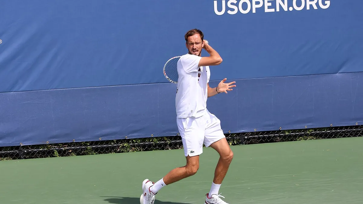 Daniil Medvedev hitting a forehand on a hard court at the 2023 US Open