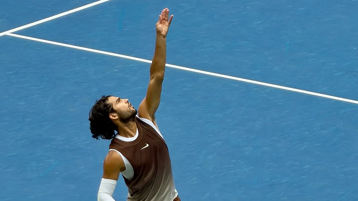 Carlos Alcaraz serving on a hard court at the 2026 US Open
